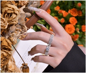 Detailed view of luxury S925 silver double ring set with vintage hollow woven texture
