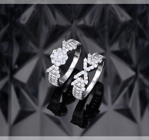 Detailed view of S925 silver wedding ring set featuring micro-paved zirconia and arrow motif