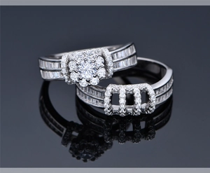 Macro view of S925 silver double ring set with round halo cubic zirconia and channel setting