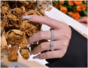 Detail of luxury S925 silver double ring set with marquise diamonds on model hand