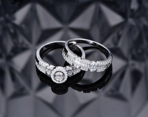 Macro detail of silver ring set with oval cubic zirconia on dark geometric surface