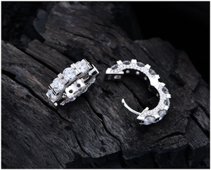 Macro shot of S925 sterling silver hoop earrings with pavé set clear cubic zirconia