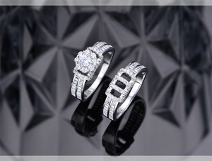 Macro shot of silver S925 stacking ring set with flower-shaped micro-pave diamonds