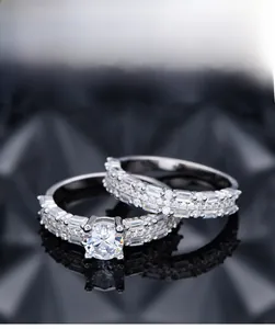 Macro shot of 925 silver rings set with brilliant 5A zircon stones on black silk
