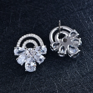 Sparkling S925 silver flower stud earrings with clear zircon stones on a black base