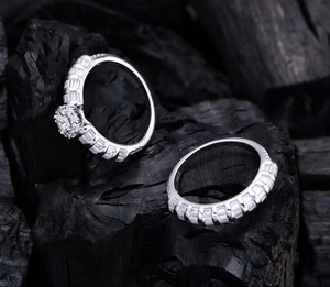Macro detail of 925 sterling silver ring set featuring cubic zirconia on charcoal background