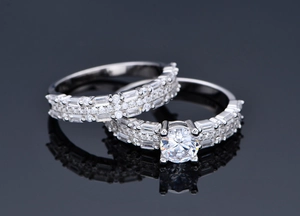Macro detail of 925 silver wedding set with round solitaire and pave diamond bands