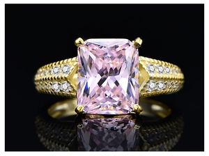Macro view of a 5.6ct radiant cut pink gem ring with gold-plated S925 silver band