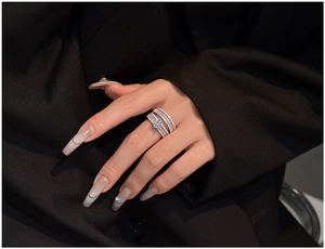 Close-up of luxury S925 silver wedding ring set featuring marquise cut CZ on hand