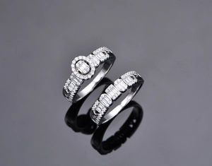 Detailed macro view of S925 silver double ring set with oval zircon and baguette stones