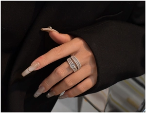 Close-up of luxury S925 silver double ring set with round centerpiece and pavé stones