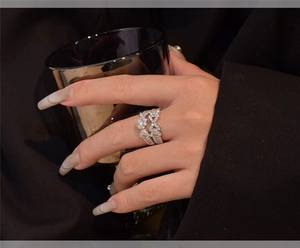 Macro shot of S925 silver arrow snowflake stacking rings with micro-pave cubic zirconia