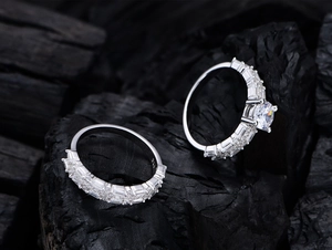 Detailed macro shot of S925 sterling silver wedding set with six-claw moissanite ring