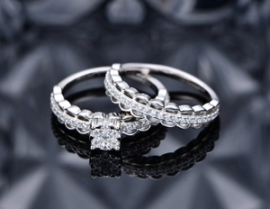 Detail of S925 silver lace mesh double ring set with diamond flower cluster and wavy band