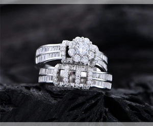 Macro shot of silver bridal ring set with flower-shaped micro-pave and baguette diamonds