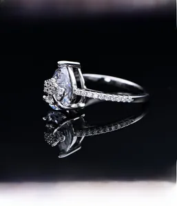 Macro detail of microscopic micro-setting process for pear-shaped diamond silver ring