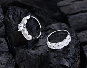 Macro shot of S925 silver wave-textured rings set with brilliant round and baguette cubic zirconia