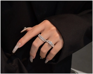 Close-up of S925 sterling silver ring set with marquise cut stones on a hand