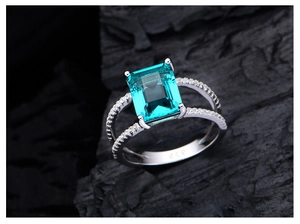Close-up of S925 silver ring featuring an emerald-cut dark green gemstone and pave stones