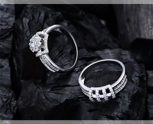 Macro shot of S925 silver double ring set with round crystal and crown halo design