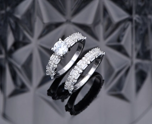 Macro view of 925 silver bridal ring set with sparkling zircon and baguette cut stones