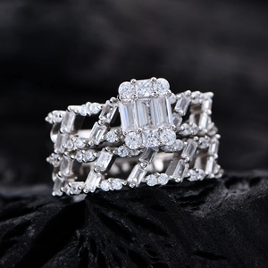 Luxury S925 silver layered ring set featuring baguette-cut and round cubic zirconia stones
