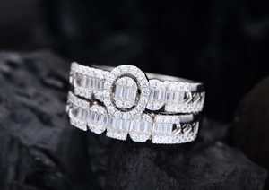 Macro detail of silver halo ring set featuring oval-cut stones and pavé set diamonds
