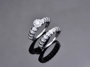 Macro shot of S925 sterling silver ring set showing baguette-cut stones and S925 hallmark