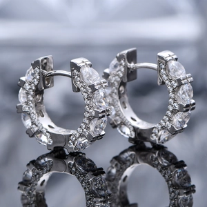 Sparkling S925 sterling silver huggie earrings with marquise-cut cubic zirconia inlays