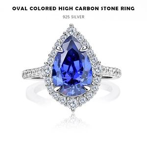 Detailed halo setting view of pear-cut deep blue sapphire stone in 925 silver ring