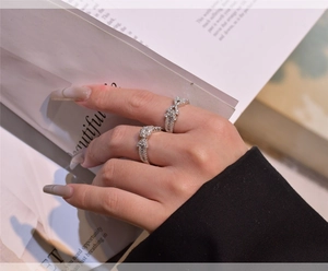 Detailed view of S925 silver rings with micro-pave cubic zirconia in arrow snowflake design