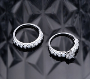 Detailed close-up of 925 silver wedding ring set with emerald cut cubic zirconia stones