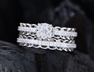 Macro shot of S925 silver lace ring set with floral cluster and pavé diamonds