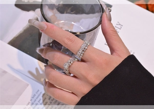 Close-up of sparkling S925 silver snowflake stackable rings set with cubic zirconia stones