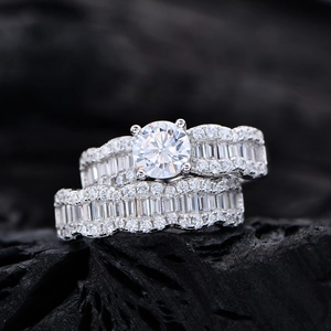 Wavy zircon sterling silver ring set featuring a bright round main diamond on black stone