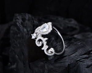 Macro detail of 925 sterling silver stamp on vintage crown ring with pear cut zircon