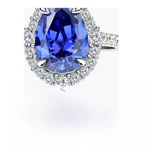 Macro shot of a pear-cut blue sapphire ring with a halo of white carbon diamonds