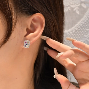 Modern sterling silver rectangle stud earrings with colorful zircon stones on model
