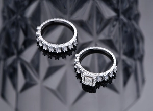 Macro shot of S925 sterling silver rings with geometric zircon stones and S925 engraving