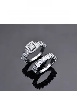 Macro shot of 925 silver ring set with princess and baguette cut cubic zirconia