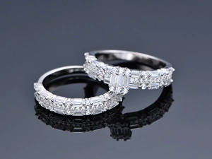 Macro detail of 925 sterling silver stacked rings with baguette and round zircon stones