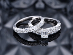 Macro shot of silver stacking ring set with baguette and round cubic zirconia pavé stones
