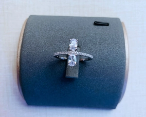 Detail of 925 silver ring featuring two oval-cut crystals and pavé-set diamonds