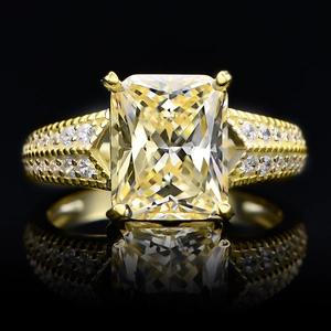 5.6ct Radiant-cut yellow carbon diamond ring in 14k gold plated silver on black background