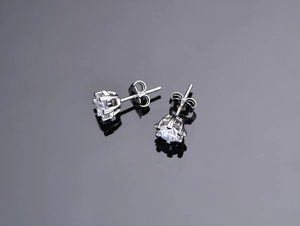 Detailed view of 925 silver six-prong stud earrings with round brilliant cubic zirconia