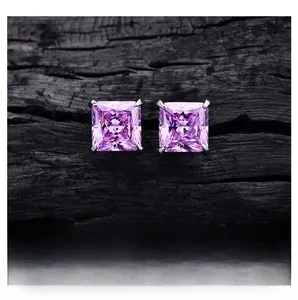 Detail of square princess cut pink diamond stud earrings with 4-prong silver setting