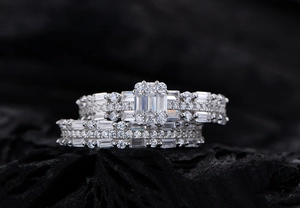 Macro shot of 925 silver rectangular checkered ring set with brilliant zircons on black stone