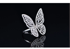 Macro view of butterfly ring with shimmering cubic zirconia and hollow wing details