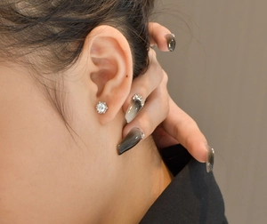 Close-up of classic 925 sterling silver snowflake stud earrings with 5mm cubic zirconia