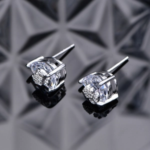 Floral sterling silver stud earrings with pear-cut cubic zirconia in silver finish